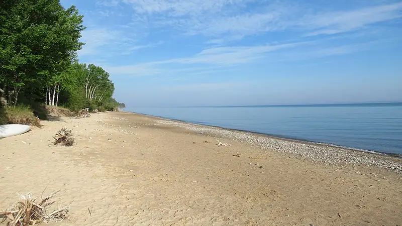 Sandy Lake Superior beach with a band of pebbles at the waterline